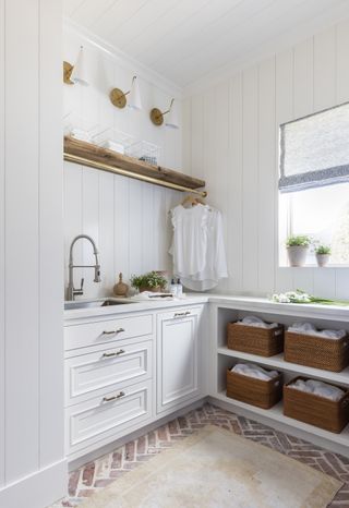 small laundry room ideas multiple styles of storage in white room by Marie Flanigan