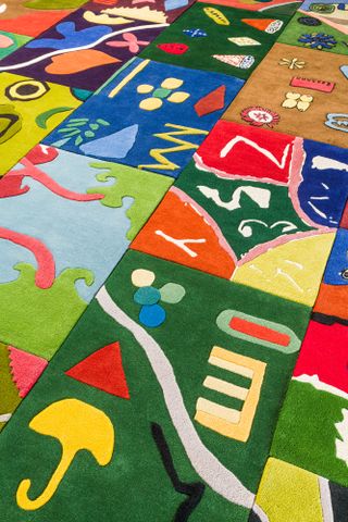 A grid of colourful rugs, from an initiative by Alex Proba, Little Proba and the Toni Garrn Foundation