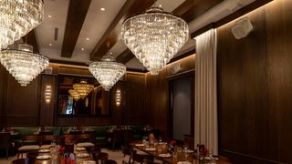 A lavish restaurant and its speakeasy decked out for nighttime guests.