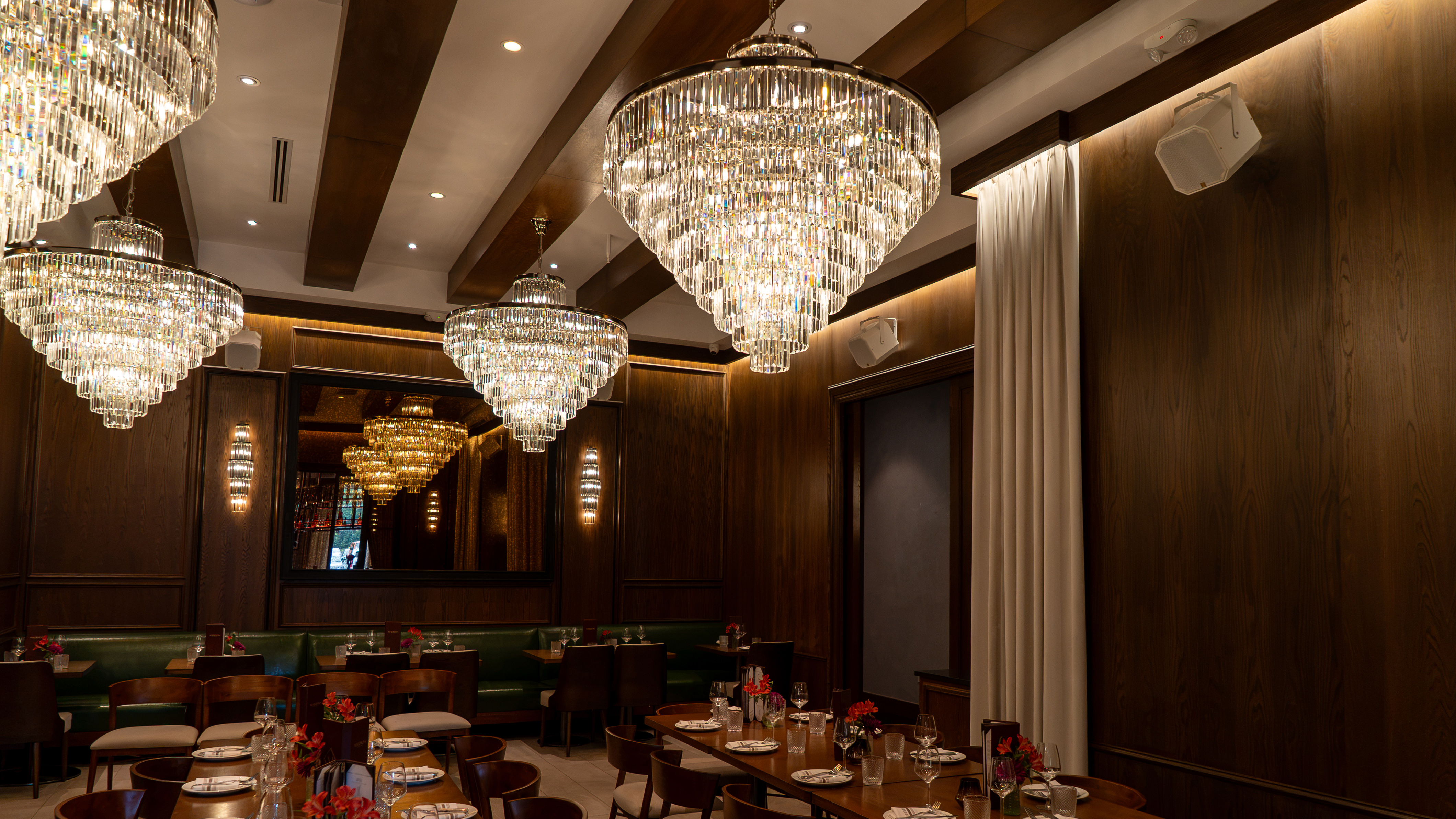 A lavish restaurant and its speakeasy decked out for nighttime guests. 