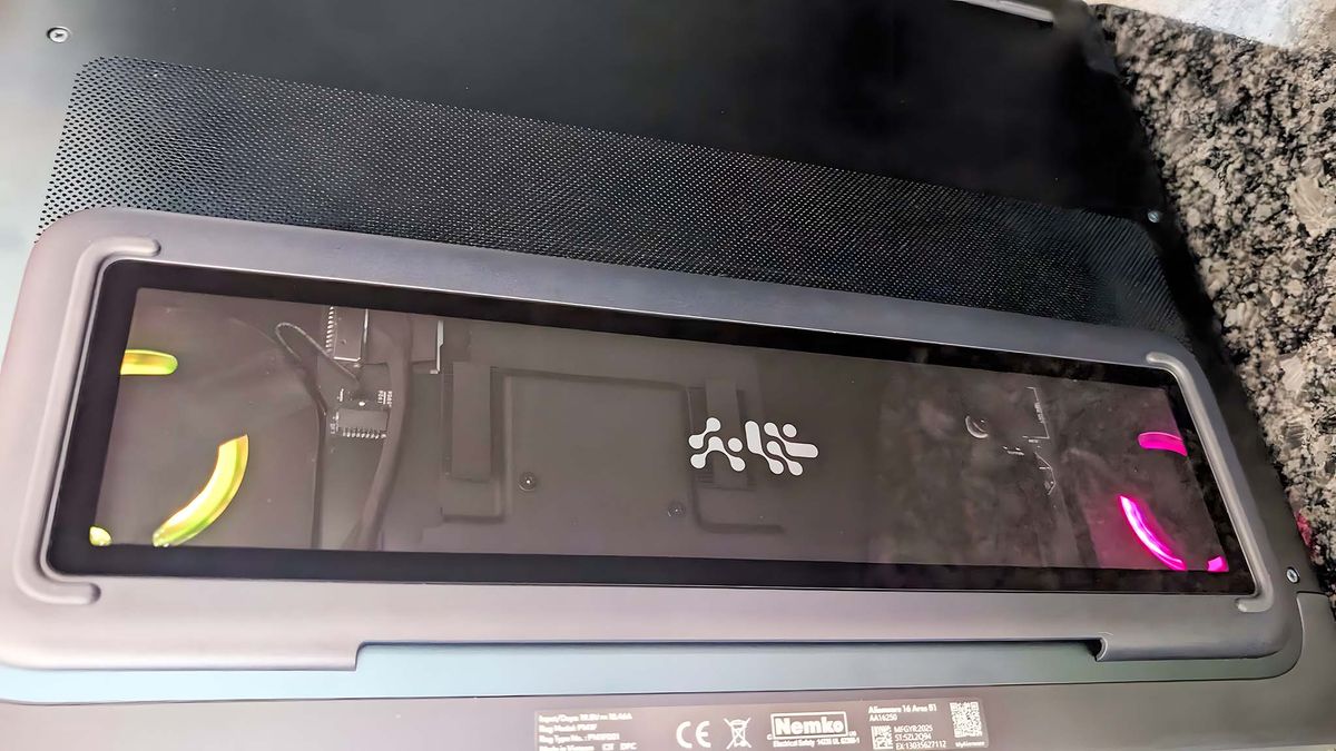 Underside of the Alienware Area-51 16 Gaming Laptop with fans highlighted with RGB lighting.