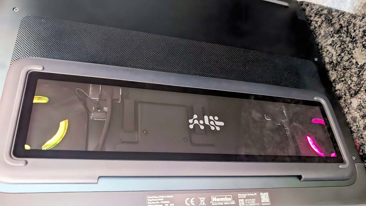 Underside of the Alienware Area-51 16 Gaming Laptop with fans highlighted with RGB lighting.