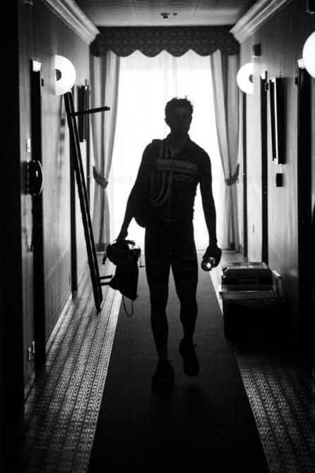 A rider walks back to his room after a hard day of racing.