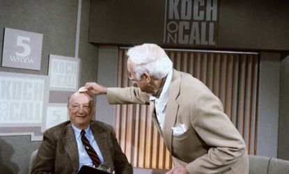 Ed Koch gets his head powdered before the start of his new TV program called "Koch on Call" on March 15, 1987.