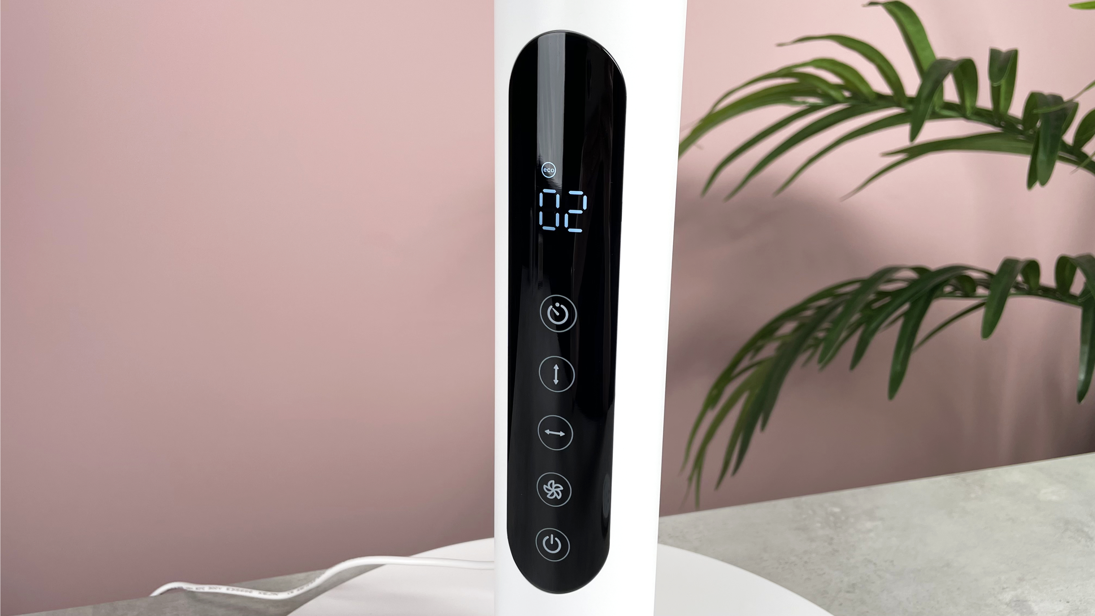 The LED screen and touch controls on the front of the fan's stand.