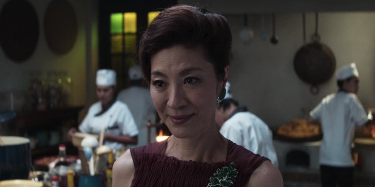 Crazy Rich Asians scene in a kitchen surrounded by cooks