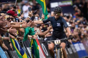 Jenny Rissveds (Team 31 Ibis Cycles Continental) celebrates taking the elite women's XCO victory at the UCI Mountain Bike World Cup 2024 opening round in Mairiporã