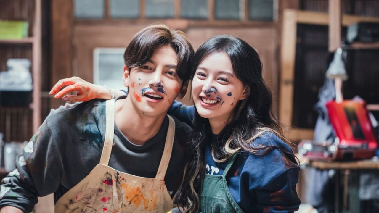 a couple covered in paint takes a picture in a paint studio, in the must-watch k-drama &#039;lovestruck in the city&#039;