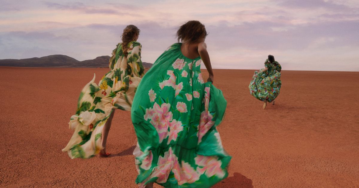 Farm Rio models running wearing floral dresses