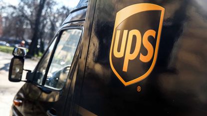UPS logo on side of brown delivery truck