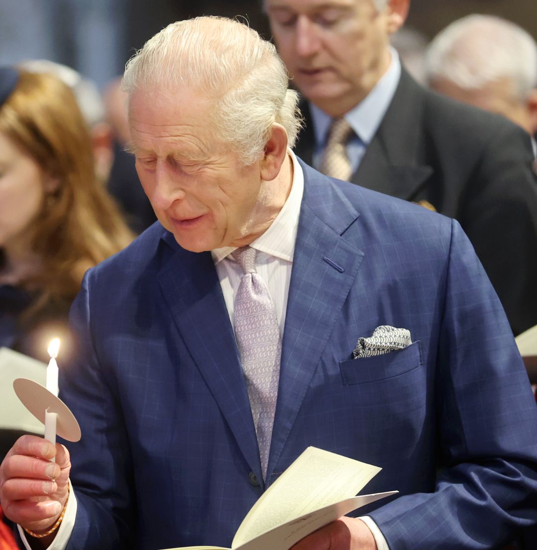 King Charles holding a candle 