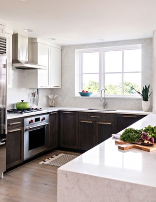 white kitchen with quartz countertop by Taniya Nayak Design