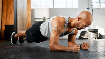 Man holding a plank