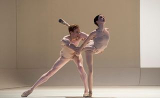 Two ballet dancers in tan outfits