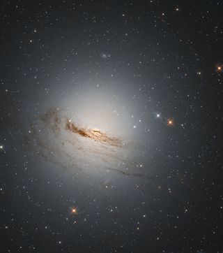 This photo, captured by the Hubble Space Telescope, depicts a dying galaxy called NGC 1947.