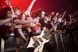 Into the pit, Paolo Gregoletto gets in among the crowd on the Unholy Alliance Tour