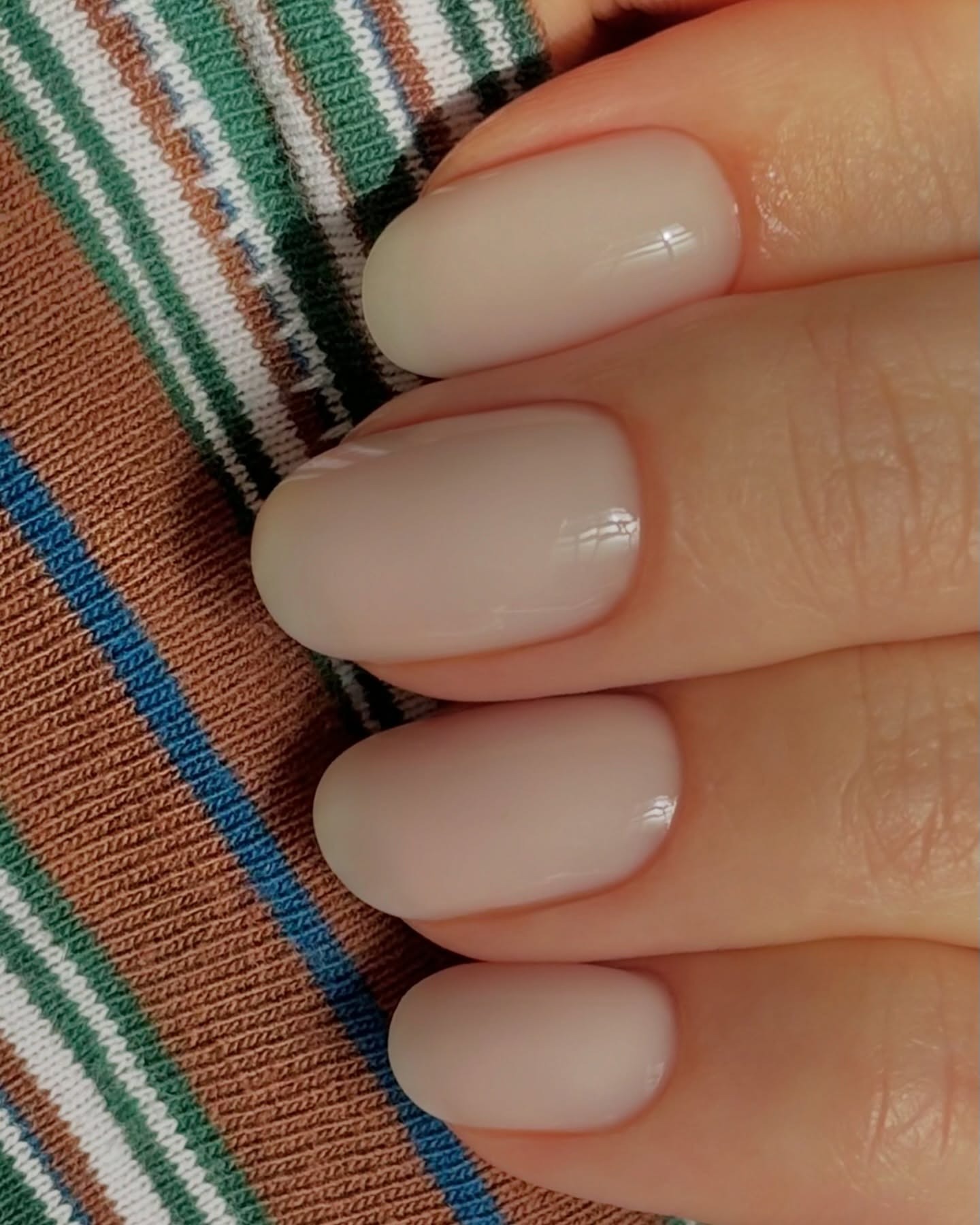 A sheer beige manicure