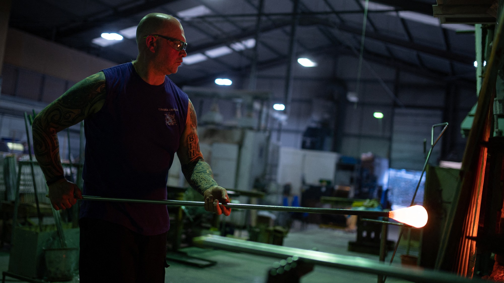 A glassblower at work in a factory near Barrow-in-Furness