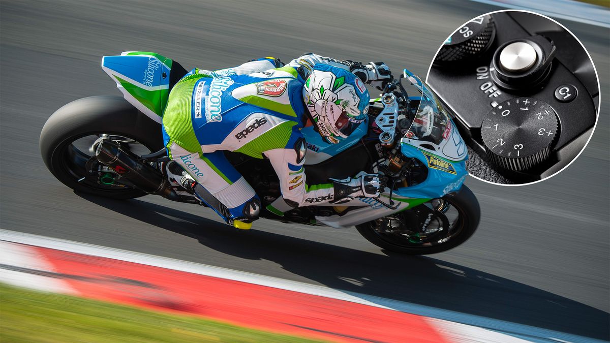 Superbike rounds a corner on a racetrack, with an inset roundel showing the exposure compensation dial on a Sony camera 