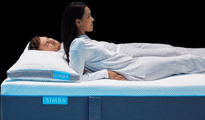 Man and woman lying on Simba mattress and pillows
