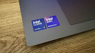 Intel Core Ultra 9 and Intel Arc Graphics badges on the MSI Prestige 16 AI Evo (B2HM) business laptop.