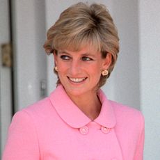 Princess Diana wears a bright pink skirt suit and Meghan Markle wears a gold cut-out dress