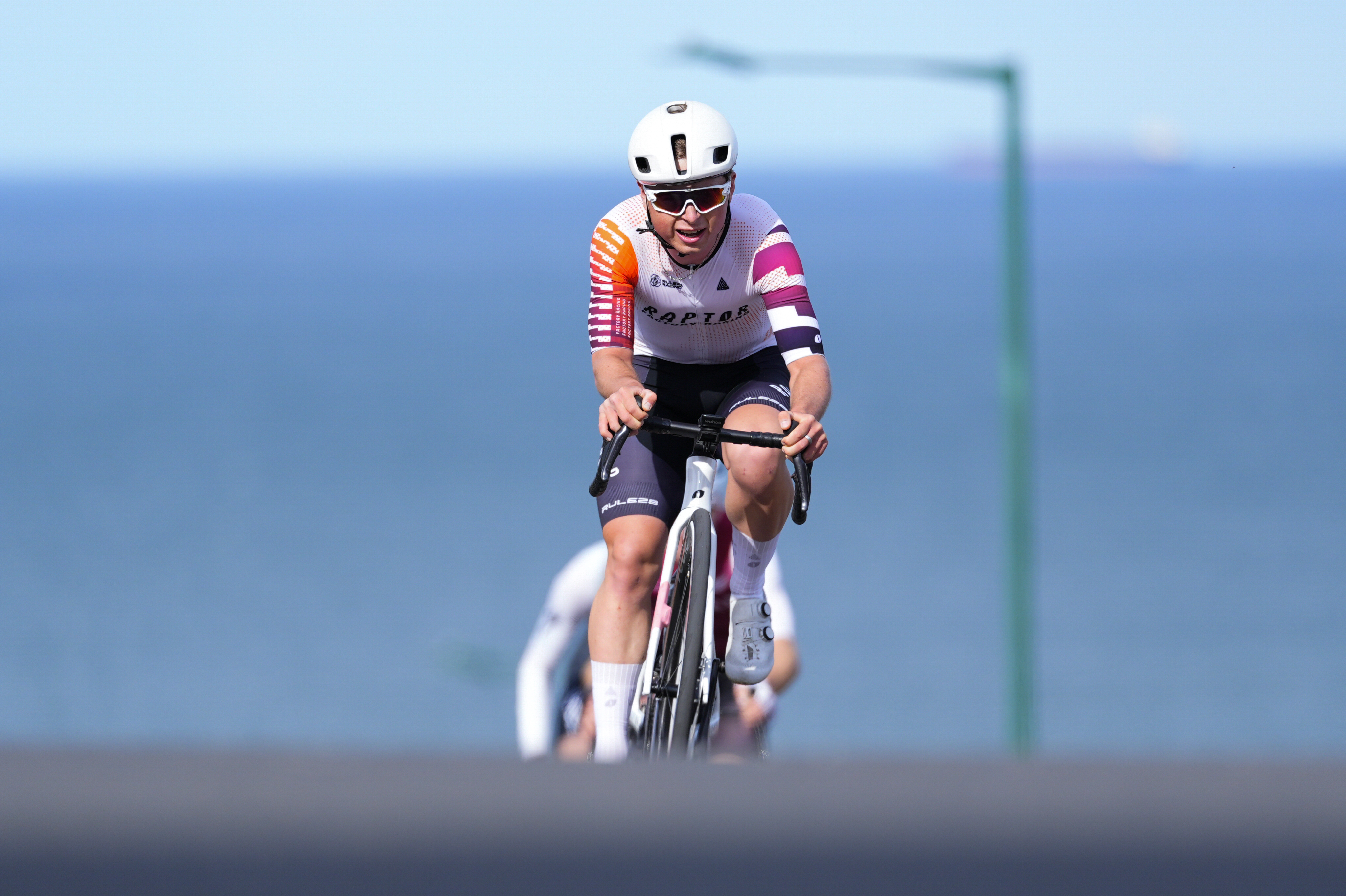 Dylan Hicks riding up a hill
