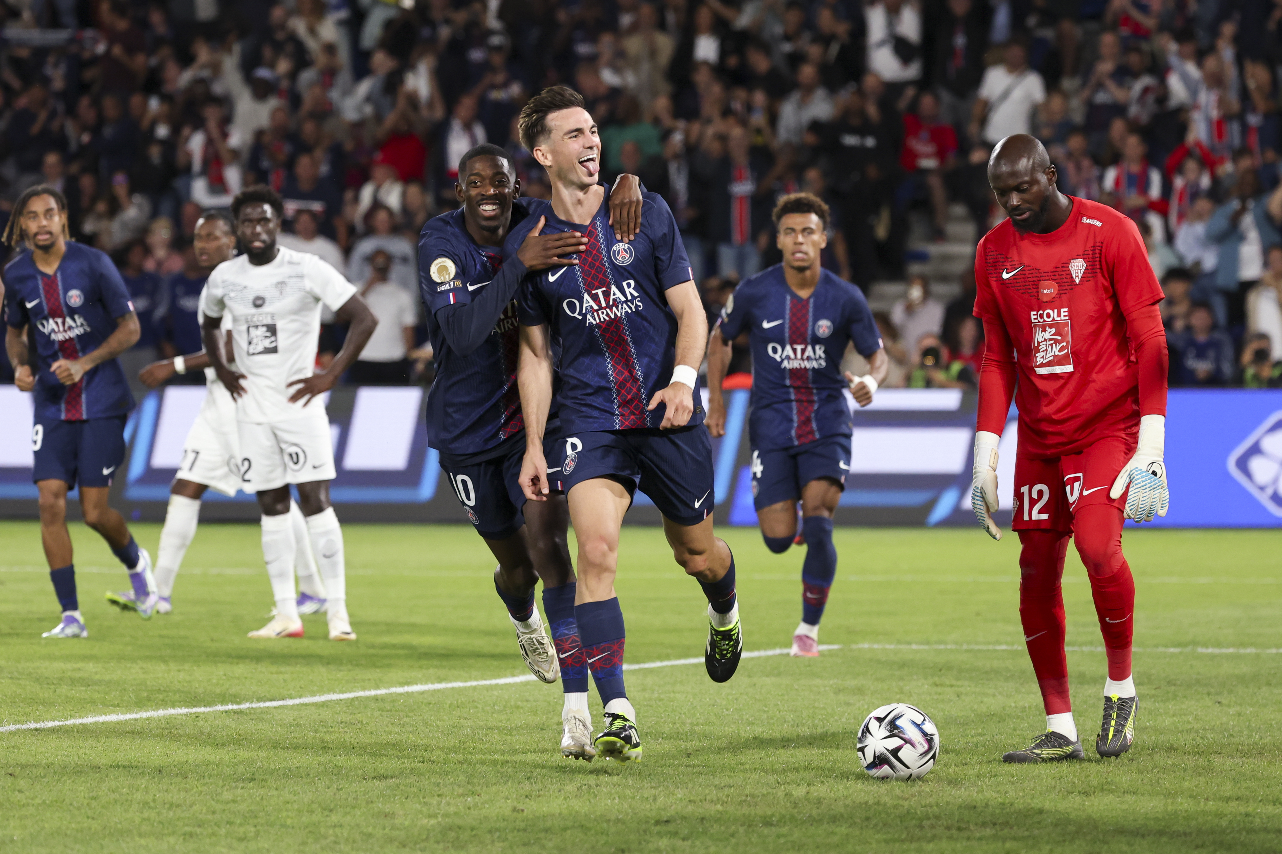 Fabian Ruiz Pena #8 of Paris Saint-Germain celebrates scoring his team's first goal with Ousmane Dembele #10 of Paris Saint-Germain during the Ligue 1 McDonald's match between Paris Saint-Germain and Angers SCO at Parc des Princes on August 22, 2025 in Paris, France.