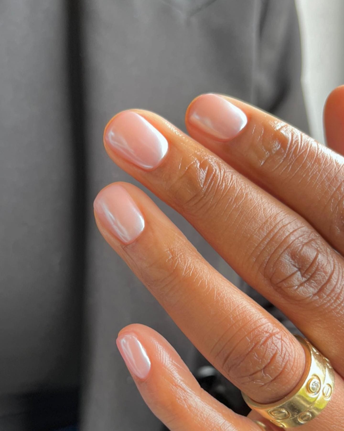 Short nails with a subtle pink pearly nail colour
