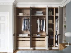 fitted wardrobes/closet space within a bedroom, doors are open