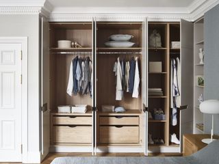fitted wardrobes/closet space within a bedroom, doors are open