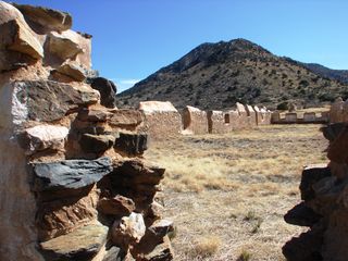 When arriving at the saddle of Apache Pass today, visitors will find a barren landscape with the foundations of the 74 historic buildings that once stood here and nearly a dozen adobe and stone wall ruins.