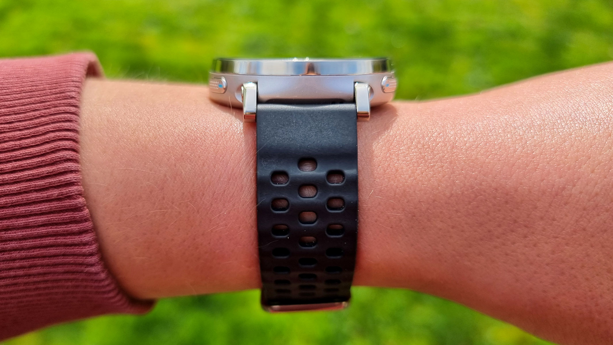 a close-up picture of our reviewer wearing the Amazfit Active 3 Premium smartwatch, a view from the side