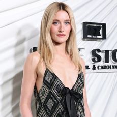 Sarah Pidgeon arrived at the Love Story premiere in a Chanel M&eacute;tiers d'Art Spring 2026 feather dress-over-pants look