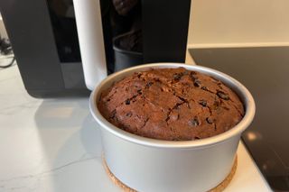 Step-by-step photo of a Christmas cake being baked in an air fryer - step 5, letting the baked cake cool