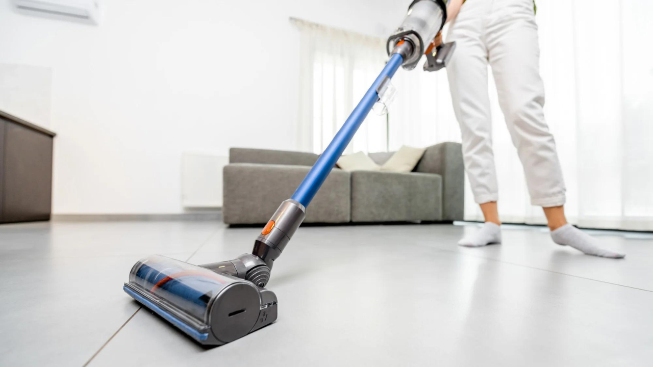 woman using dyson vacuum