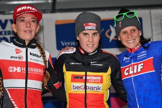 Sanne Cant atop the Scheldecross podium with runner-up Sophie De Boer and third-placed Katerina Nash