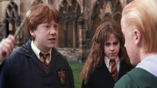 Ron Weasley (Rupert Grint), Hermione Granger (Emma Watson), and Draco Malfoy (Tom Felton) in Harry Potter and the Chamber of Secrets