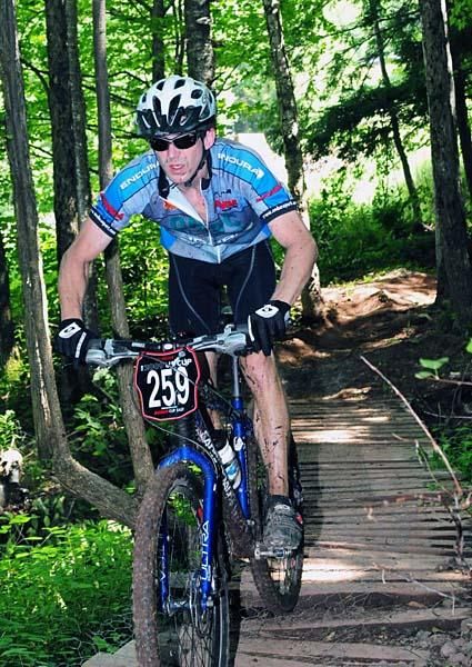 Brett Sherwood cross one of the many bridges with one lap to go