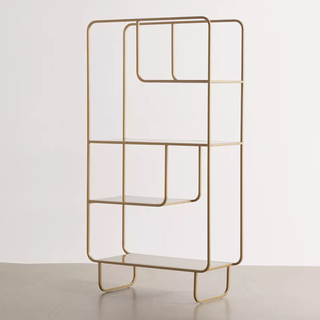 A gold wire bookshelf with varied levels