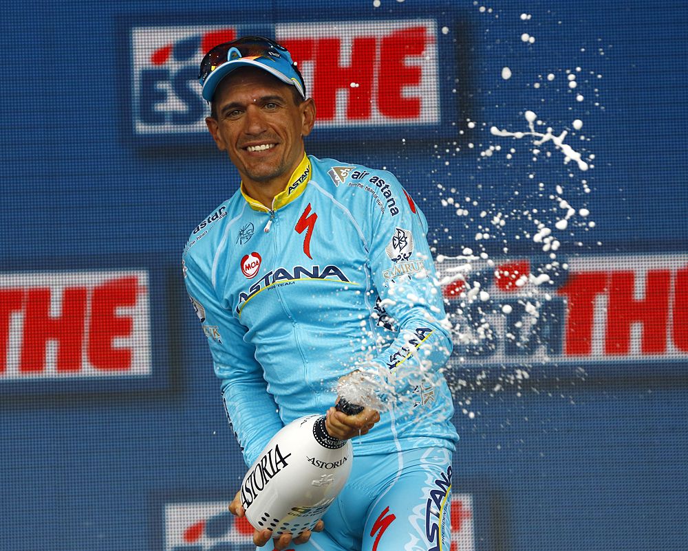 Paolo Tiralongo (Astana) celebrates his win on the stage 9 podium