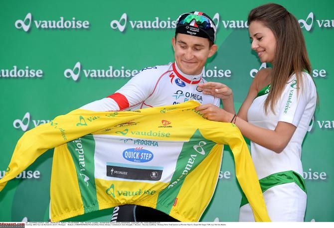 Michal Kwiatkowski (Omega Pharma-QuickStep) puts on the yellow jersey