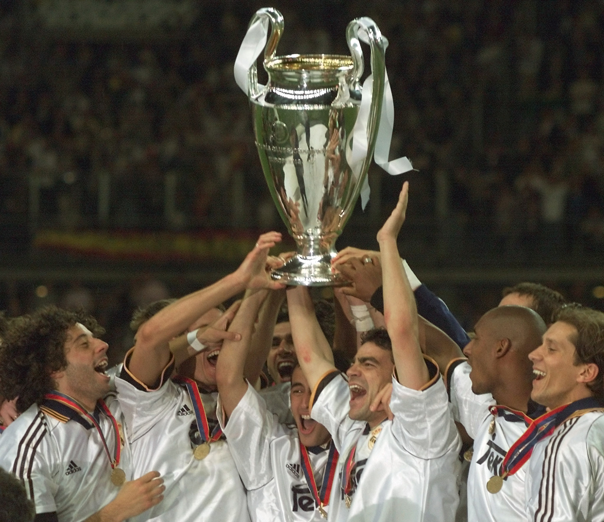 Real Madrid players celebrate with the European Cup after a 3-0 victory over Valencia in the 2000 Champions League final in Paris.