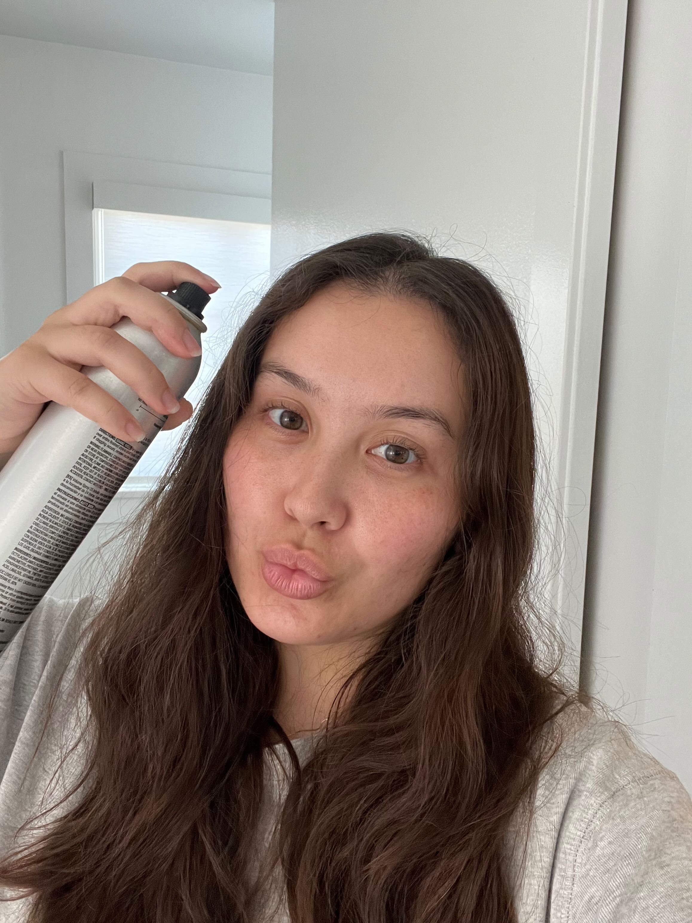 Catharine Malzahn testing Kenra Volume Spray 25 Hairspray
