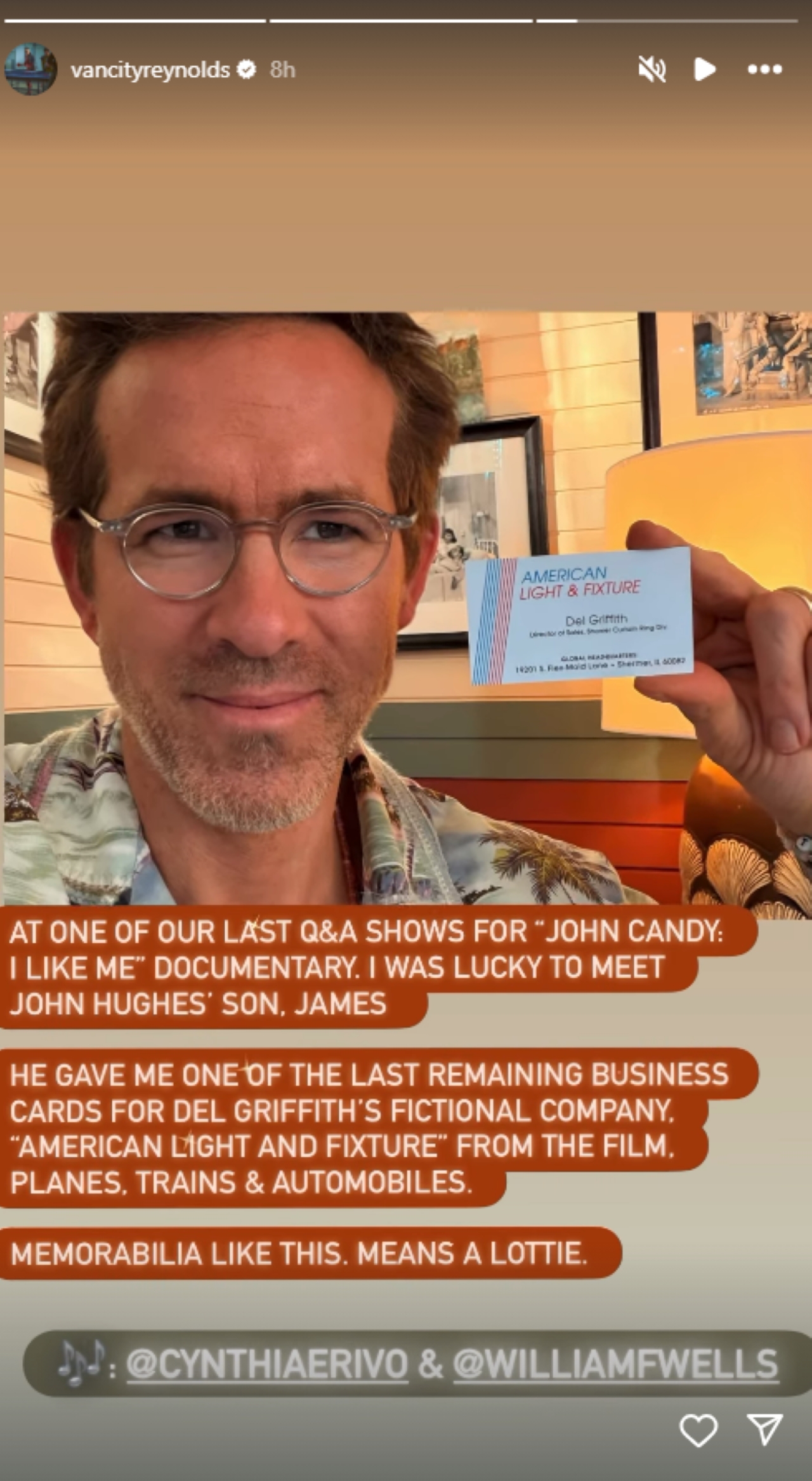 Ryan Reynolds holding American Light & Fixture business card from Planes, Trains, and Automobiles.