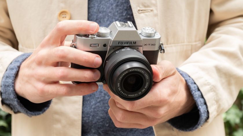 Fujifilm X-T30 III camera held in a pair of hands