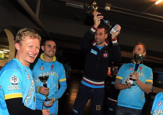 Vincenzo Nibali celebrates on the podium with Agnoli and Kessiakoff