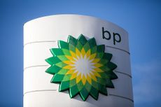 A BP Plc logo sits on a totem sign outside a gas station 