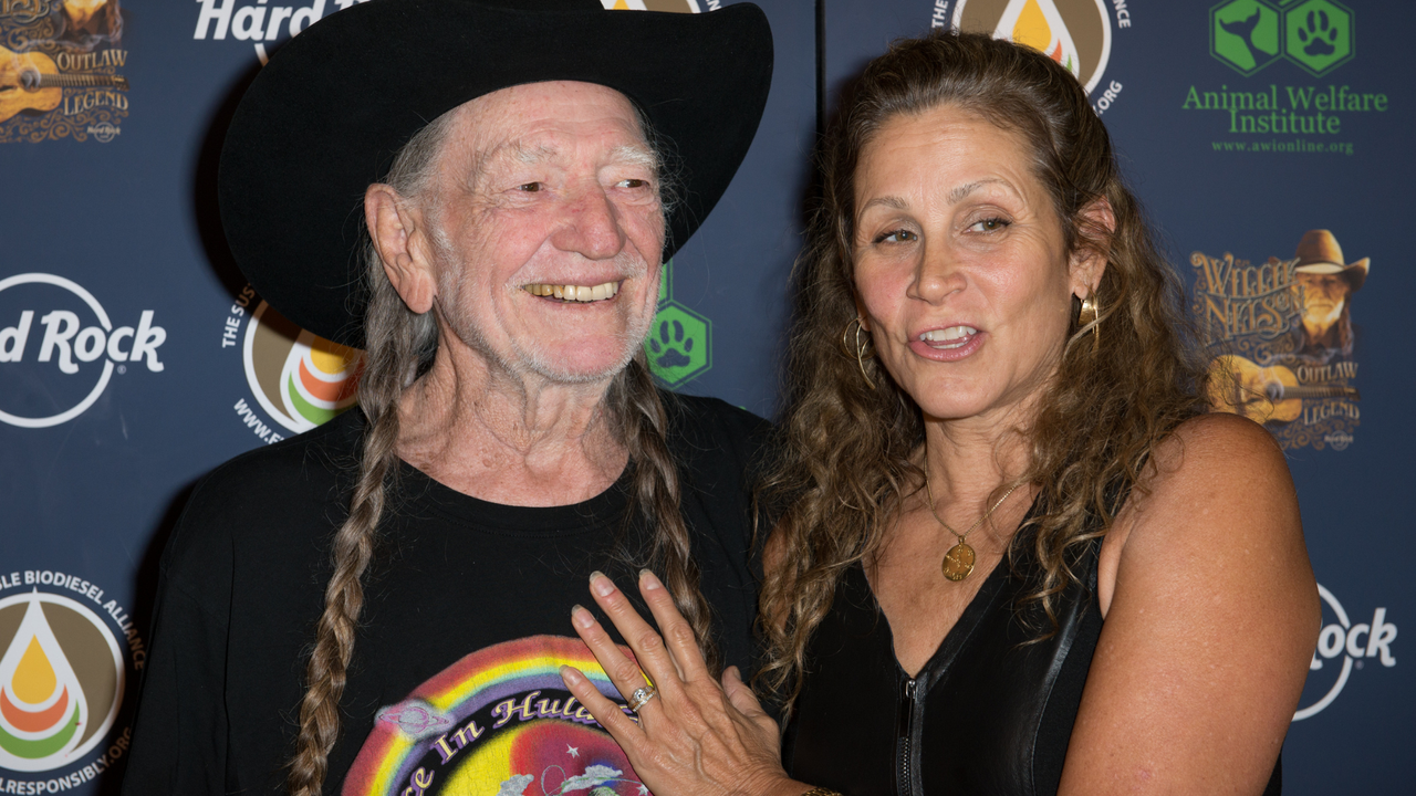 Willie Nelson and Annie D&#039;Angelo attend Hard Rock International&#039;s Wille Nelson Artist Spotlight Benefit Concer at Hard Rock Cafe, Times Square on June 6, 2013 in New York City