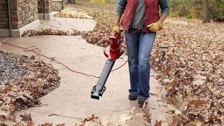 Toro 51621 being used by woman to clear path
